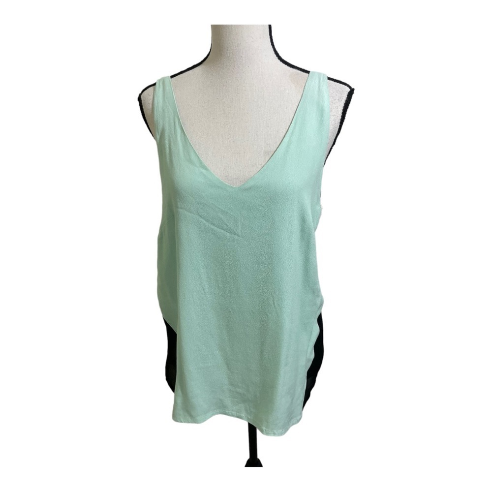 Ayres double v neck blouse with black sheer side inserts. Size medium.